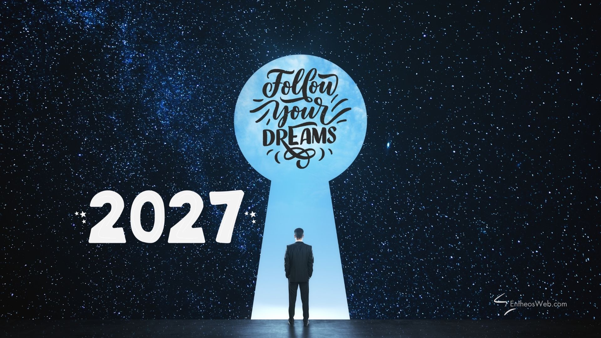 2027 follow your dreams desktop wallpaper | motivational desktop wallpaper for 2025 2026 2027 | entheosweb Man in a suit stands before a giant blue keyhole with 2027 follow your dreams desktop wallpaper'Follow your dreams' inside, set against a starry backdrop and 2027.